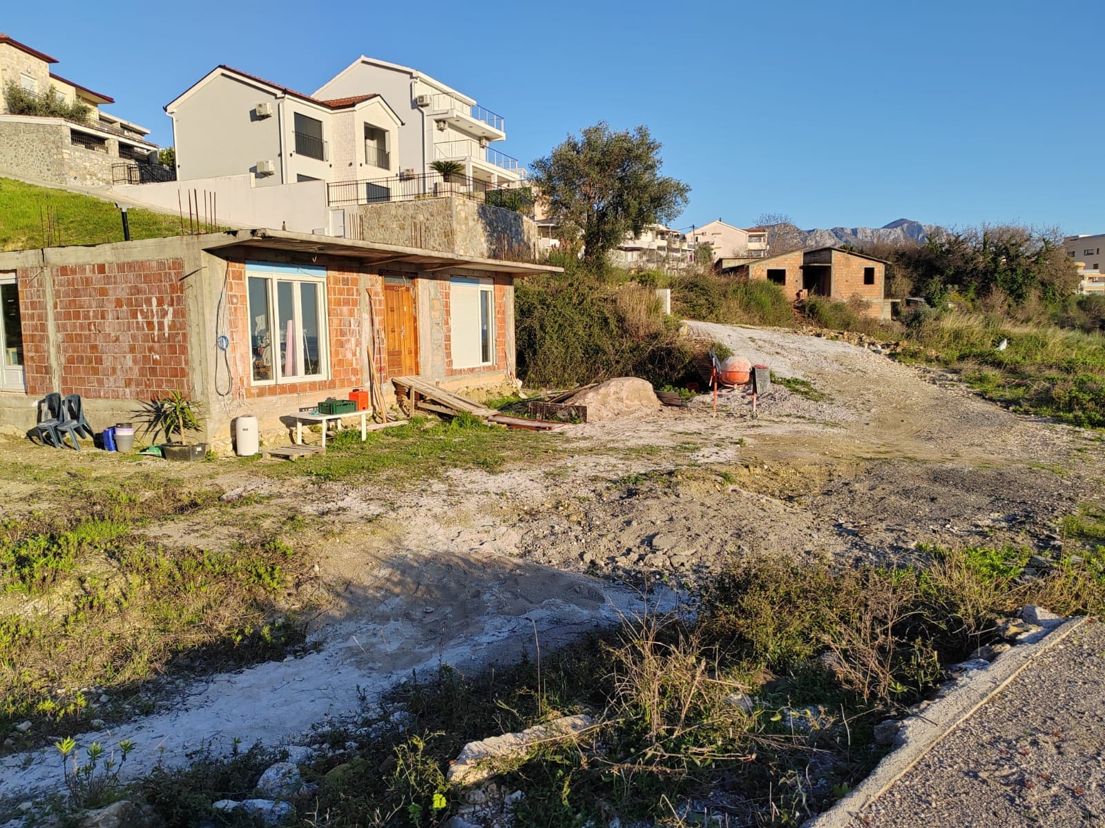 Spacious Land with Renovation-Ready House for Sale in Becici — Becici